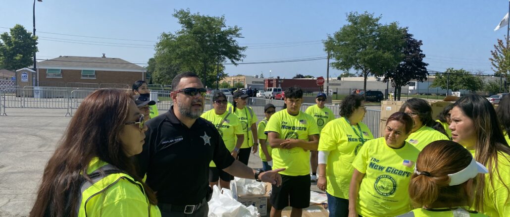 Cicero Chaplain Ismael Vargas works with more than 120 volunteers at Town of Cicero and Red Cross post-flood assistance event July 22, 2023